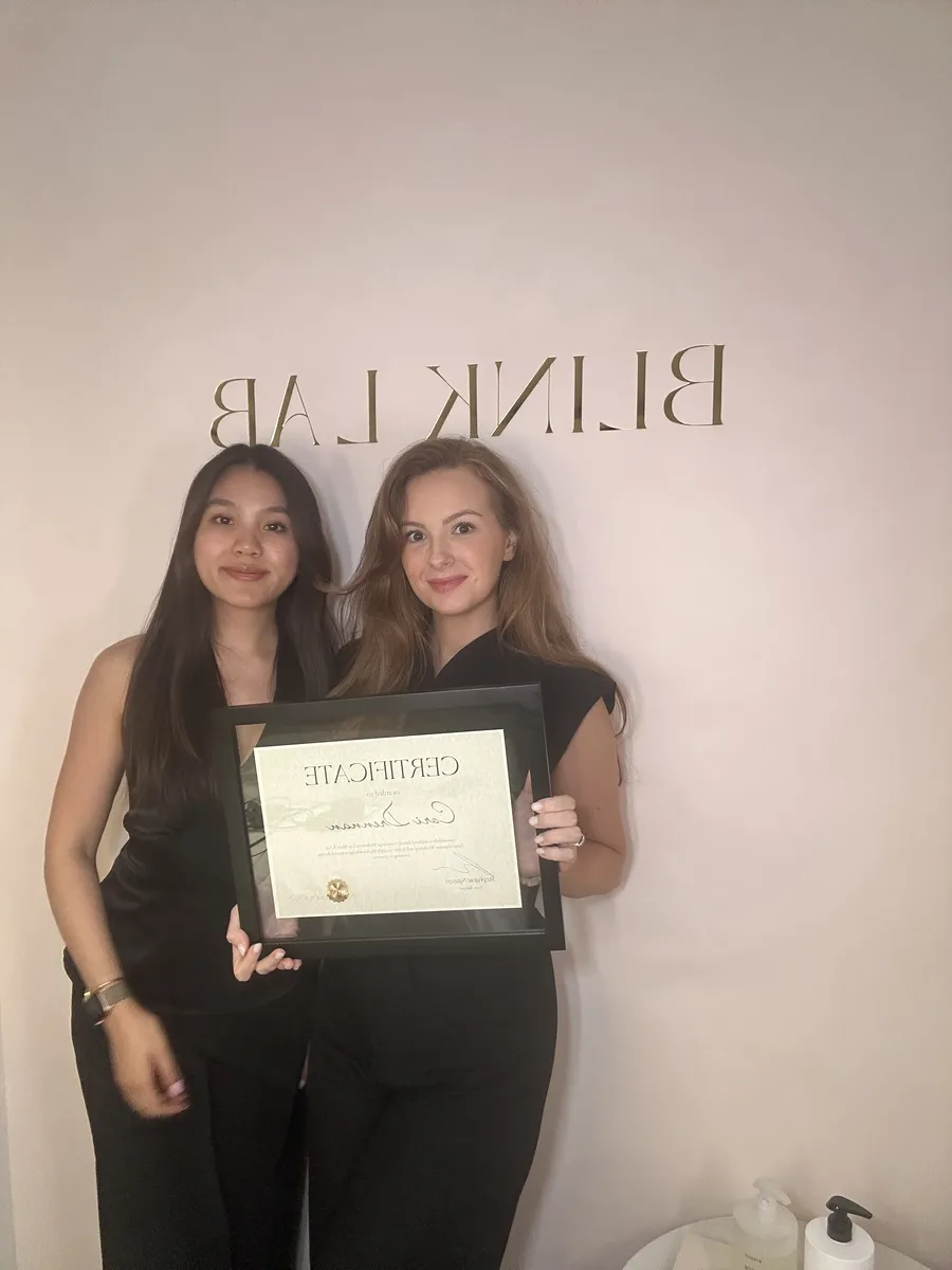 A graduate with her certificate