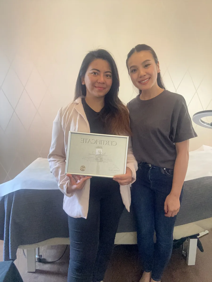 A graduate with Stephanie after training